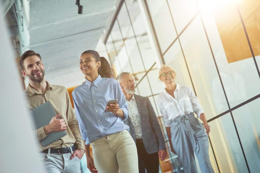 smiling business professionals walking